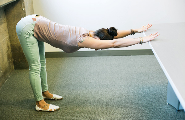 4 Yoga Poses You Can Do At Your Desk