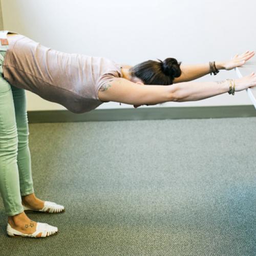 4 Yoga Poses You Can Do At Your Desk